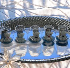 small glass cups with teddy bears in them on a tray