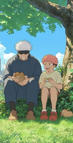 two people sitting in the grass with food on their hands and one person holding something