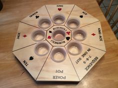 a wooden table topped with lots of cups