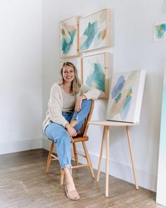 a woman sitting on a chair in front of some paintings and the caption says, my name is joy and i'm an abstract