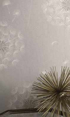 the wall paper has dandelions on it, and is silver with gold accents