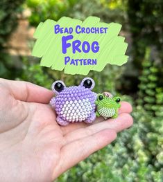 a hand holding two tiny crocheted frog earrings with the words bead crochet frog pattern on it