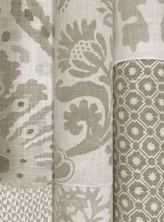 closeup of curtains with different patterns and colors in the background, including brown and white