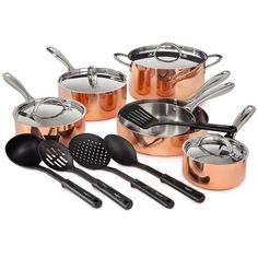 an assortment of pots and pans with utensils