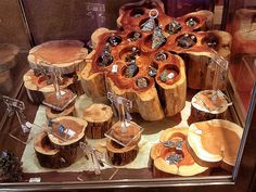 a display case filled with lots of different wooden pieces and rings on top of each other