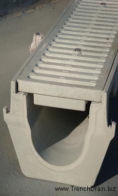 a large metal grate sitting on top of a sandy beach