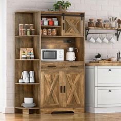 a kitchen with a microwave, coffee maker and other items on the shelves in front of it