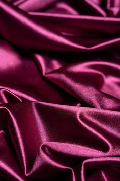 Elevate your creations with our luxurious Magenta Shiny Nylon Fabric! This silky, smooth material features a rich, glossy sheen and a striking magenta hue, perfect for glamorous evening dresses, modern bridal gowns, and high-fashion formalwear. The spandex blend provides 4-way stretch for comfort and unrestricted movement, ensuring your designs are both stylish and functional. This fabric features a lustrous satin finish that adds an elegant touch to any garment! Key Features: - Luxurious Look & Gallagher Aesthetic, Cocktail Restaurant, Frozen Jr, Modern Bridal Gowns, Glamorous Evening Dresses, Deep Magenta, Bridal Attire, Berry Color, Modern Bridal