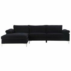 a black sectional couch sitting on top of a white floor