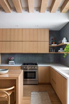 a kitchen with wooden cabinets and white counter tops