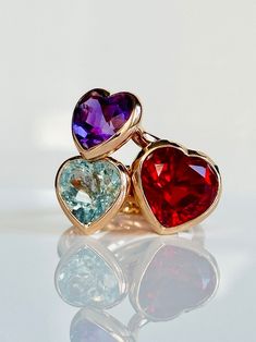 With its playful, symbolic vibe and juicy color, this ring is a perfect addition to any modern collection. Vibrant heart shaped amethyst is encased in meticulously hand finished band. This stunning ring will make a fun alternative to a traditional cocktail ring. 🔸Natural mined amethyst: 10mm x 9mm app 🔸No 2 two gems are absolutely identical  due to their natural origin. Incusion is not a defect, it is characteristic of the stone. 🔸Different monitors display color different ways. Follow us on Elegant Multi-stone Heart-shaped Rings, Elegant Multi-stone Heart Rings, Fine Jewelry Heart Cut Multi-stone Rings, Multicolor Rings For Anniversary On Valentine's Day, Multicolor Rings For Valentine's Day Anniversary, Multicolor Rings For Anniversary Valentine's Day, Heart-shaped Multi-stone Rings For Gift, Multi-stone Rings For Valentine's Day Gift, Heart Cut Multi-stone Rings For Gift