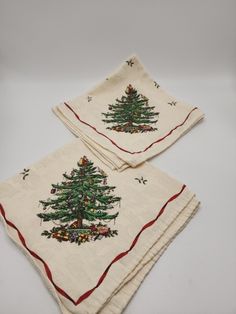 two napkins with christmas trees on them