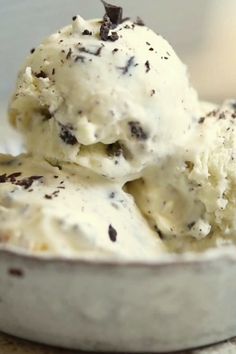 two scoops of ice cream in a bowl with the words inside the rustic kitchen