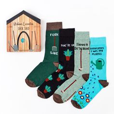 Unisex Gardening Shed Socks Gift Set Fits Mens and Ladies Sizes UK - 6 - 11 4 Pairs of Cotton Rich Socks in a Gift Box Dimensions (In Packaging): 21 x 17 x 4.5 Cm Fibre Composition:  Fork: 75% Cotton, 14% Polyamide, 10% Polyester, 1% Elastane Suc & Wet Plants: 70% Cotton, 23% Polyamide, 6% Polyester, 1% Elastane Hoe: 75% Cotton, 18% Polyamide, 6% Polyester, 1% Elastane Gardening Shed, Gardening Gift Set, Cozy Candles, Socks Gift, Foodie Gifts, Quirky Gifts, Sock Gifts, Box Dimensions, Premium Gift