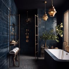 a bathroom with blue tiles and gold fixtures