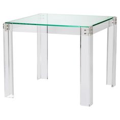 a clear glass table with metal legs