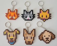 six pixel keychains with different types of animals on them