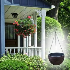 a hanging planter in front of a blue house