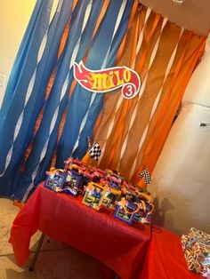 the table is set up with candy and candies for a race car themed birthday party