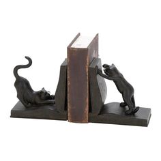 a bookend that has two cats on it