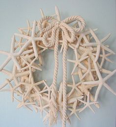 a white starfish wreath hanging on the wall