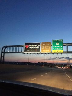 an interstate highway with several signs on it