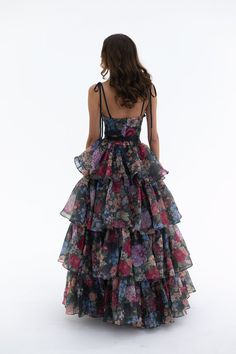 Embody the capricious spirit of Shakespeare's trickster fairy in this two-piece ensemble. A slinky slip dress with a coquettish bow-tied bust meets a voluminous tiered skirt, with an extra-long satin ribbon closure. Scattered blooms dance across the inky canvas, echoing the mischievous footsteps of A Midsummer Night’s beloved Puck. This is a two piece set. Two piece slip dress set with tiered maxi skirt Slip dress features a peek-a-boo cutout and underwire cups with a ribbon bow tie at bust Incl Trickster Fairy, Pink Tulle Prom Dress, Princess Evening Dress, Silk Dressing Gown, Ruffle Maxi Skirt, Princess Prom Dresses, Floral Prom Dresses, Corset Skirt, Puff Dress