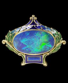 Marcus & Co. - An Art Nouveau brooch, about 1900, New York. Enamelled gold set with opal. 3.6 x 4.2cm. #Marcus #ArtNouveau #brooch Hair Assesories, 1909 Fashion, Movement Jewelry, Egg Artistry, Enamel Jewellery, Nouveau Jewelry