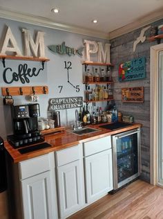 a coffee shop with wooden counters and white cabinets