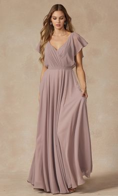 So flowy, this flutter-sleeve long formal evening gown is remarkably versatile yet affordable. Priced under $150, this beautiful a-line formal gown has a pleated deep v-neck bodice with short flutter sleeves that flow over the shoulders before trimming the deep v-back. The stylish short-sleeve long gown has banding at the waist that tops the floor-length skirt as it flows to the floor in a flattering a-line shape. Offered in misses and plus sizes, this budget-priced long formal evening gown is s Sheer Overlay Dress, Special Ocassion Dresses, Dresses Materials, Jenny Yoo Bridesmaid, Rusty Rose, Formal Bridesmaids Dresses, Chic Brides, Formal Dresses With Sleeves, Jenny Yoo