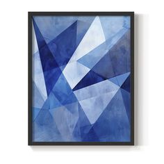 a blue abstract painting hanging on the wall