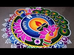 a colorful rang art design with peacocks and flowers on the ground for diwali