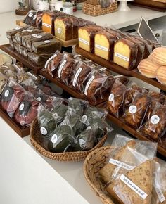 breads and pastries on display in a bakery