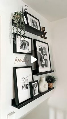 some black and white pictures are hanging on the wall next to other framed photos,