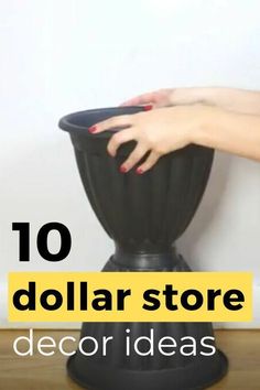 a woman's hand on top of a black vase with the words 10 dollar store decor ideas