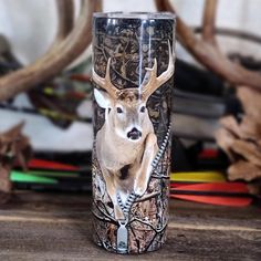 a tumbler cup with a deer head on it