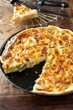 a quiche with one slice missing from it