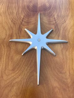 a star shaped object sitting on top of a wooden table