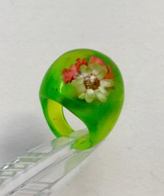 Lucite Acrylic Plastic ring.   Light Green Color  Diaphanous with Flower field illusion Ring Size 5 (15.75 mm)  Ring in Green color with illusion of the Flower field  inside of the ring. PLEASE! Before ordering, be sure to look carefully Photo. decide on the size to avoid any misunderstandings. If you need additional photos or have questions about this ring, I am at your service. Colors in photos may differ depending on your monitor settings.     Customer satisfaction and 5 star rating are very important to us. We accept returns within 30 days, however, we guarantee the highest quality, So please send us an email with your question and feedback! If you want to buy an expected item, please ask me a question before buying.  You can also look at my other lots. Thank you for your attention! (A Summer Rings, Plastic Ring, Acrylic Plastic, Color Ring, Flower Field, Light Green, Green Colors, Statement Rings, Favorite Jewelry