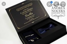 an open box containing two cufflinks and a bow tie with the words cavallero nocera written on it