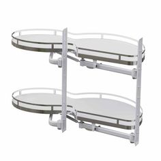 two white metal shelves with circular glass shelves