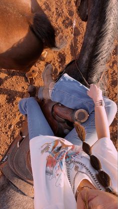 a woman riding on the back of a brown horse