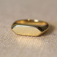 This ring is the perfect choice for men who are looking for a unique and stylish piece of jewelry. It is made of 925 silver with 14k Yellow Gold Vermeil and features a bold bar design that is sure to stand out. The Yellow color is perfect for making a statement and will match any outfit.     Handmade item  Material detail  Metal: Sterling Silver with 14k Yellow Gold Vermeil  Hypoallergenic and Lead, Cadmium, and Nickel Free.  Gift wrapping available  Jewelry Pieces Made in New York Cirty USA. Wh Special Engagement Ring, Korean Writing, Fine Gold Jewelry, Gold Face, Logo Gifts, Personalized Ring, Ring White Gold, Solid Gold Jewelry