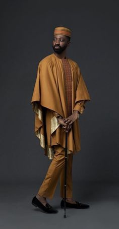 Fitted Ceremonial Kaftan With Traditional Drape, Elegant Formal Kurta With Traditional Patterns, Elegant Kurta With Traditional Drape For Ceremonies, Traditional Gold Suits For Ceremonial Occasions, Elegant Traditional Drape Kurta For Ceremonies, Elegant Sets For Eid And Traditional Ceremonies, Gold Agbada For Wedding And Eid Festival, Festive Gold Sets For Groom, Eid Ceremony Traditional Kurta