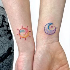 two people with matching tattoos on their wrists, one has a sun and the other has a moon