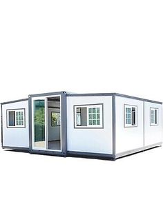 a white container house with windows and doors