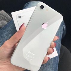 a person holding an iphone in their hand