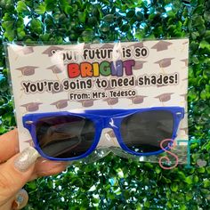 someone is holding up their sunglasses with the message, you're going to need shades