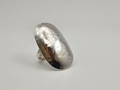 Vintage Modernist 925 Silver Hammered Knuckle Ring - Vintage 925 Solid Silver - Modernist Ring - Artisan Signed - 15 grams - Size 5.5 Welcome to Westgate Jewels!! We specialize in vintage estate, designer, and fine jewelry. Our shop consists of items that are estate, antique, and / or vintage conditions unless otherwise noted. This means that most items are prior owned and may have some imperfections such as light scratches, scuffs, and / or patina. Our items are cleaned and polished professiona Vintage Silver Hammered Rings, Silver Domed Ring Gift, Silver Hammered Oval Ring, Oval Silver Dome Ring Stamped 925, Oval Silver Hammered Ring, Handmade Oval Dome Ring In Sterling Silver, Handmade Silver Dome Ring, Handmade Adjustable Silver Dome Ring, Vintage Native American Jewelry