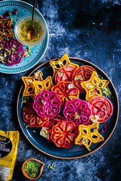 colorful food items displayed on plate next to bowl of green beans and seasoning powder